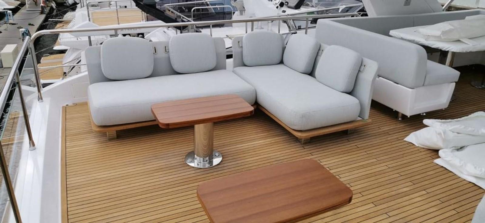 a room with a table and chairs aboard GOLDINIA Yacht for Sale