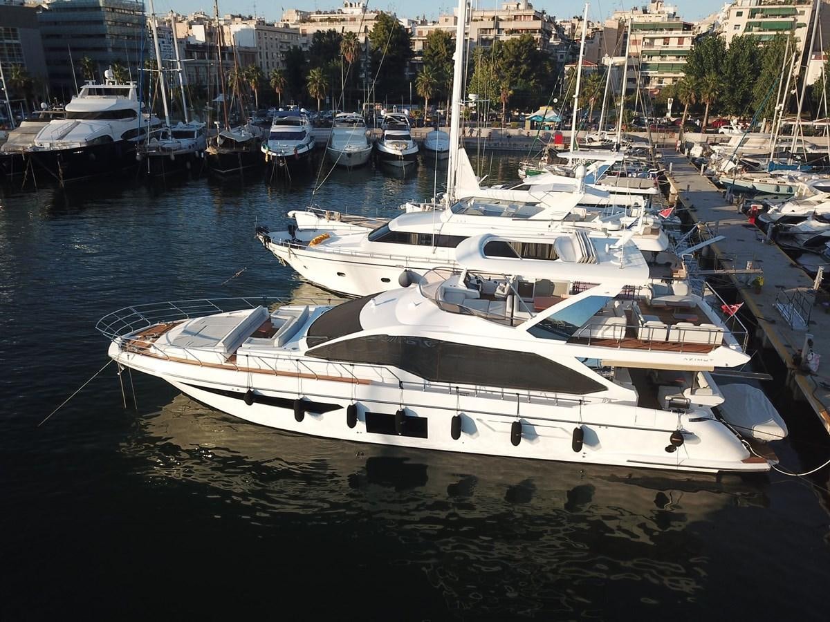 a group of boats are parked in a harbor aboard GOLDINIA Yacht for Sale