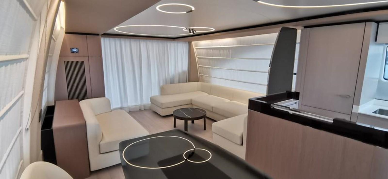 a room with a couch and a television aboard GOLDINIA Yacht for Sale