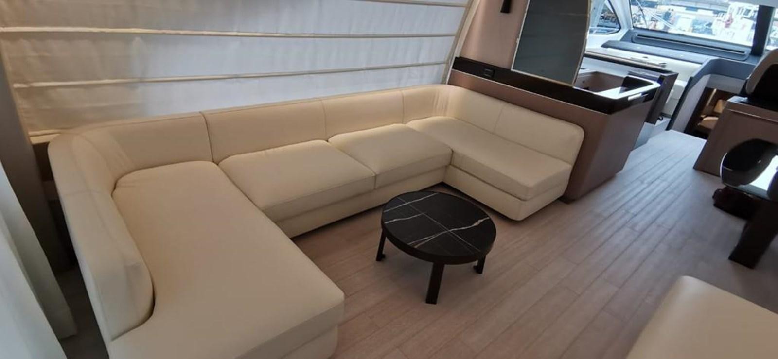 a couch in a room aboard GOLDINIA Yacht for Sale