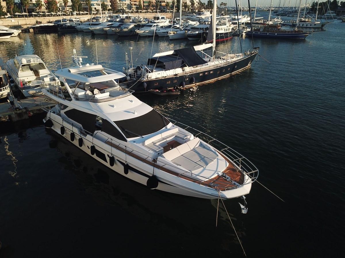 a group of boats sit in a harbor aboard GOLDINIA Yacht for Sale
