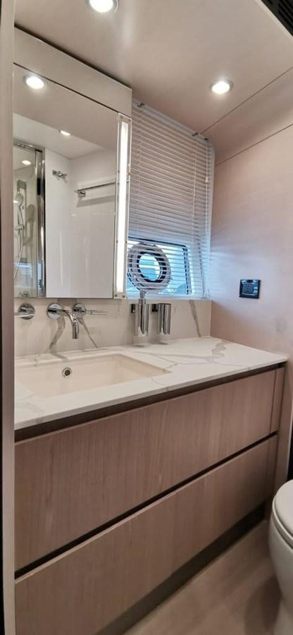 a bathroom with a large mirror aboard GOLDINIA Yacht for Sale