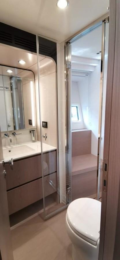 a bathroom with a glass shower aboard GOLDINIA Yacht for Sale