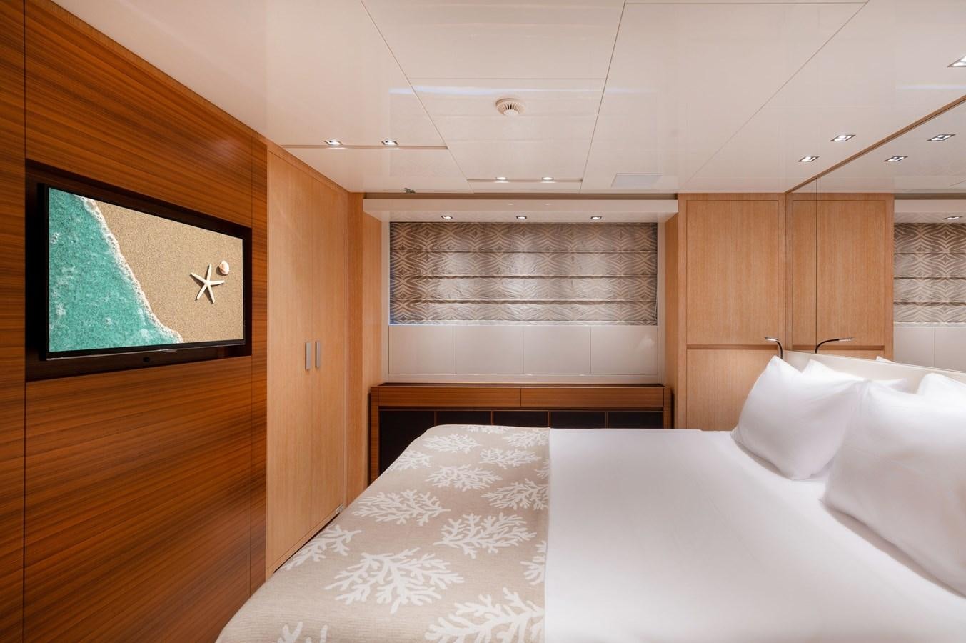 a room with a bed and a window aboard VITTORIA I Yacht for Sale
