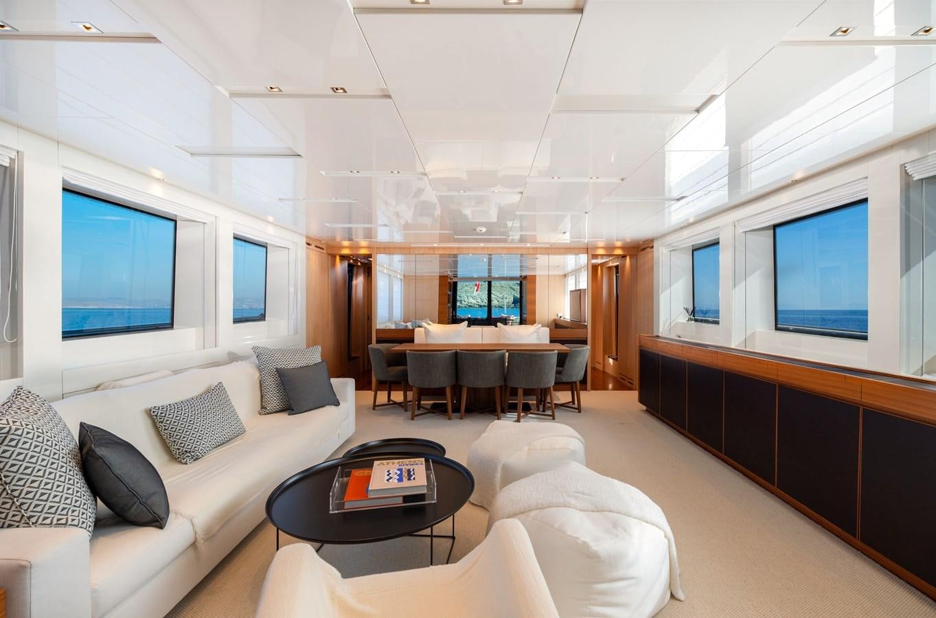 a living room with a large screen aboard VITTORIA I Yacht for Sale