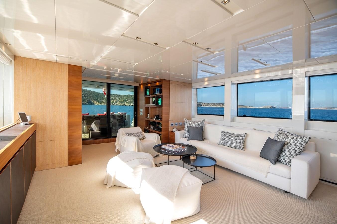 a living room with a white couch aboard VITTORIA I Yacht for Sale