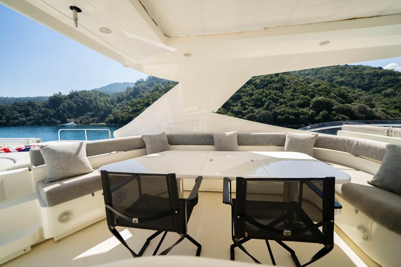 a room with a table and chairs aboard DAY DREAM Yacht for Sale