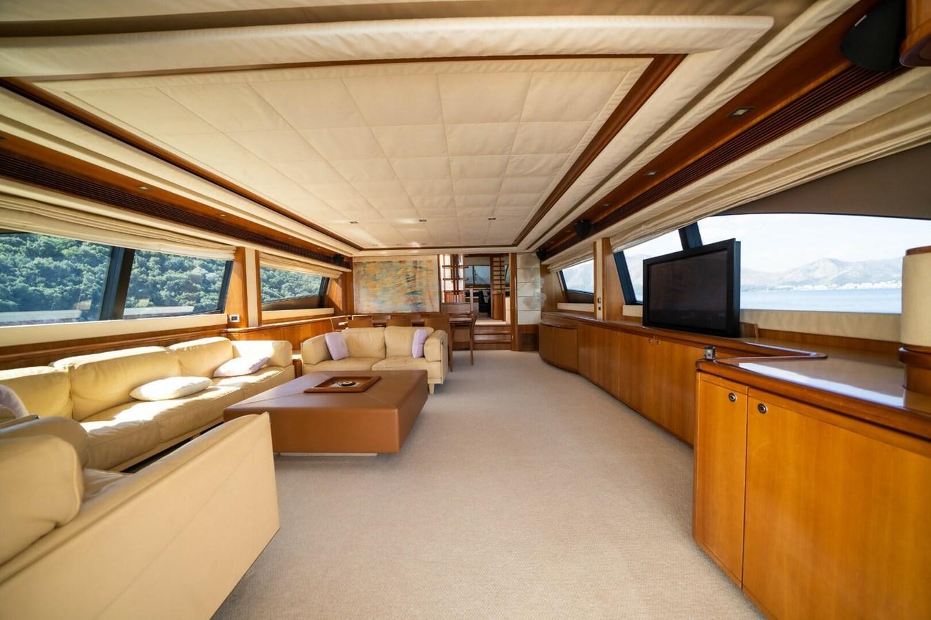 a room with a couch and a tv aboard DAY DREAM Yacht for Sale