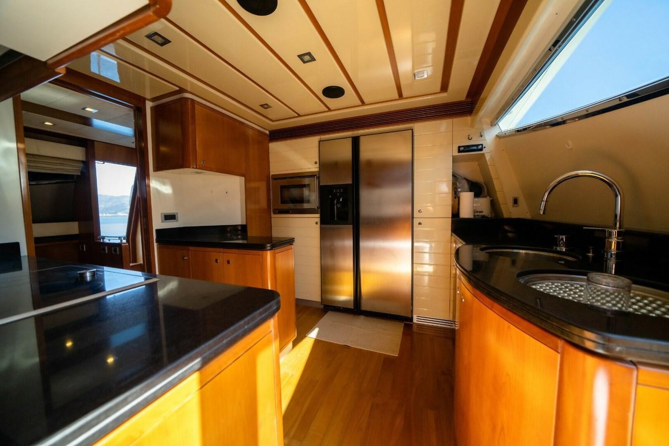 a kitchen with a large island aboard DAY DREAM Yacht for Sale