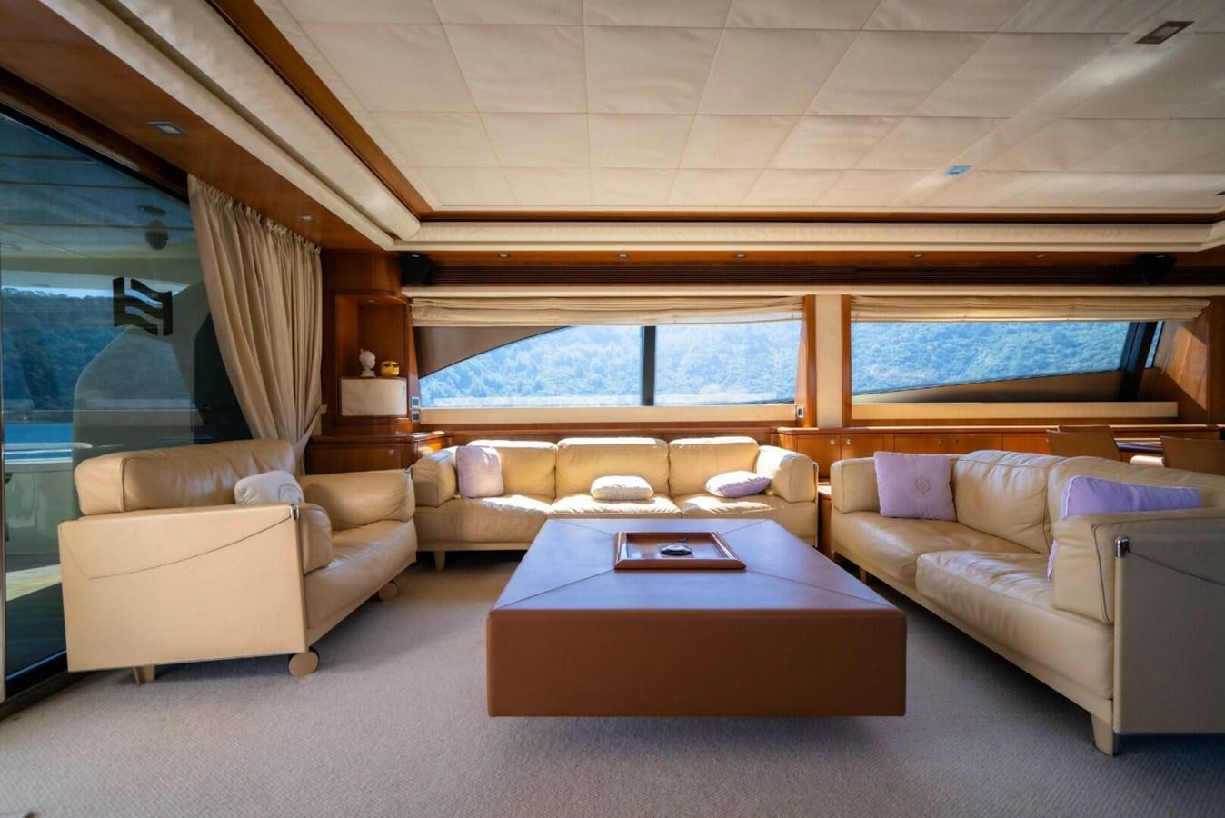 a living room with a couch and a table aboard DAY DREAM Yacht for Sale