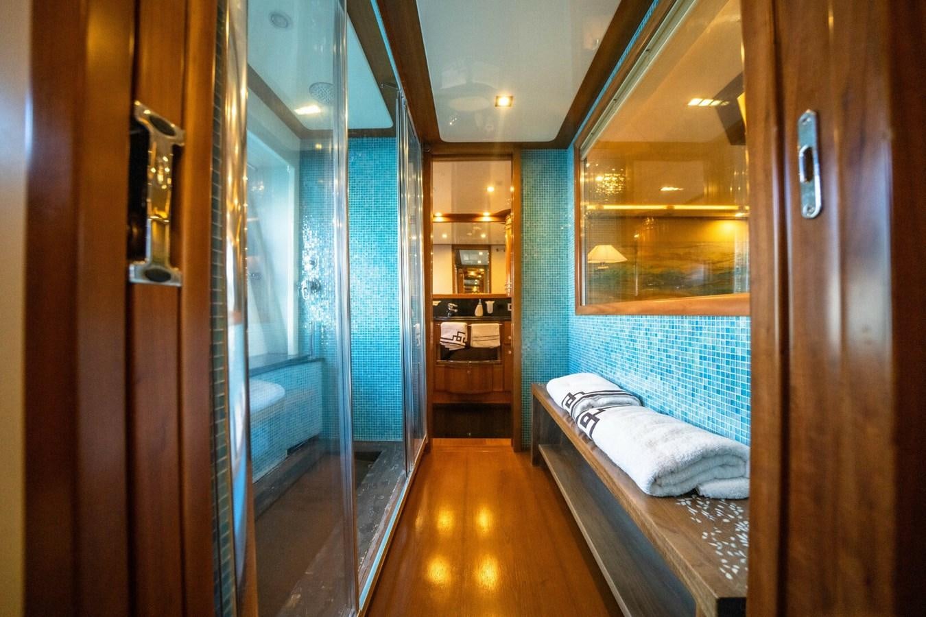a room with a bed and a mirror aboard DAY DREAM Yacht for Sale