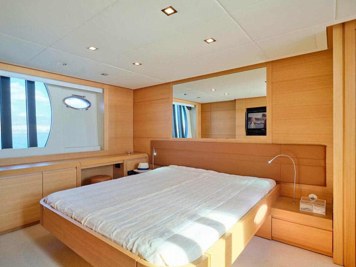 a room with a bed and a window aboard SPLENDID V Yacht for Sale