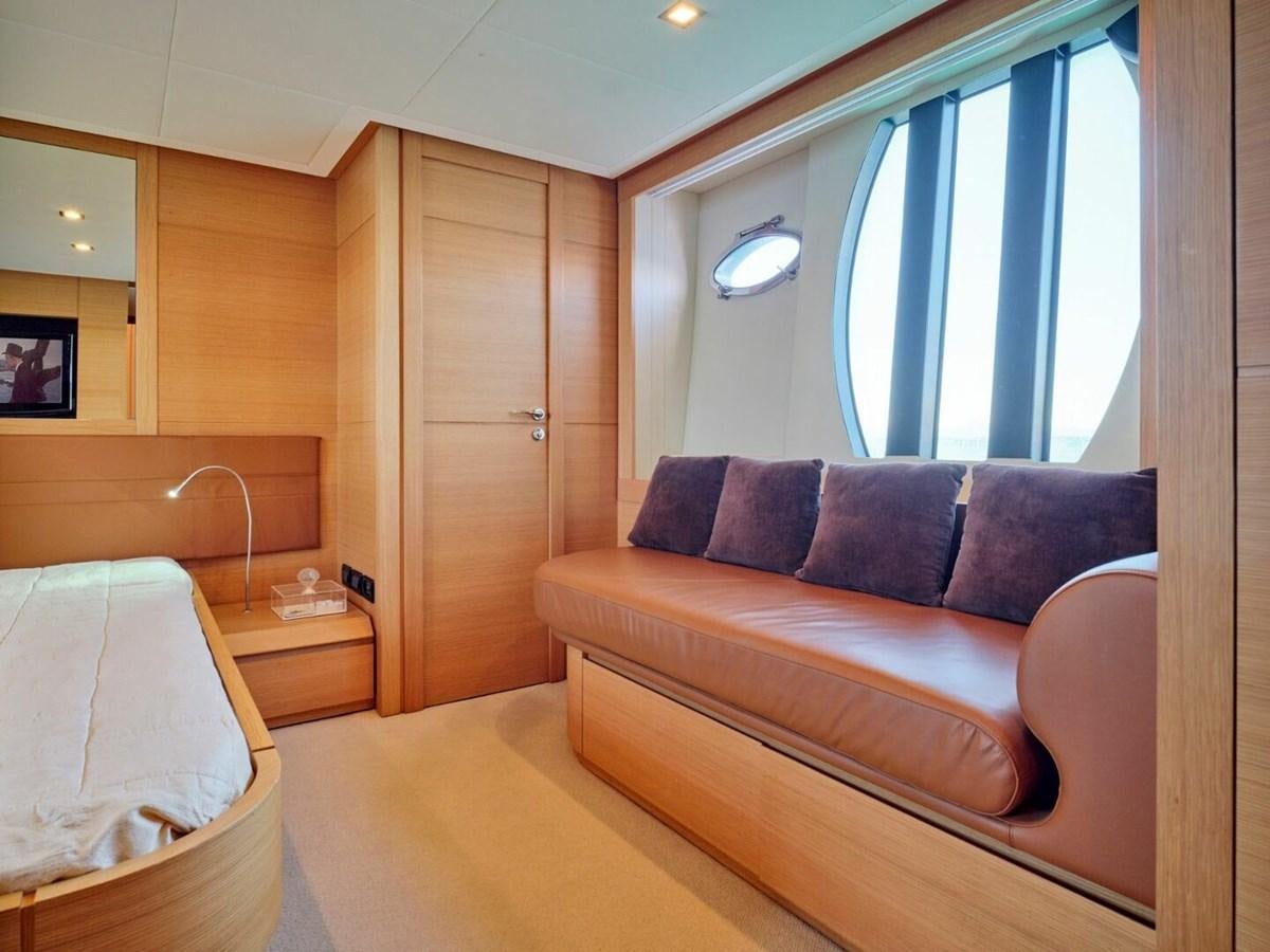 a room with a bed and a couch aboard SPLENDID V Yacht for Sale