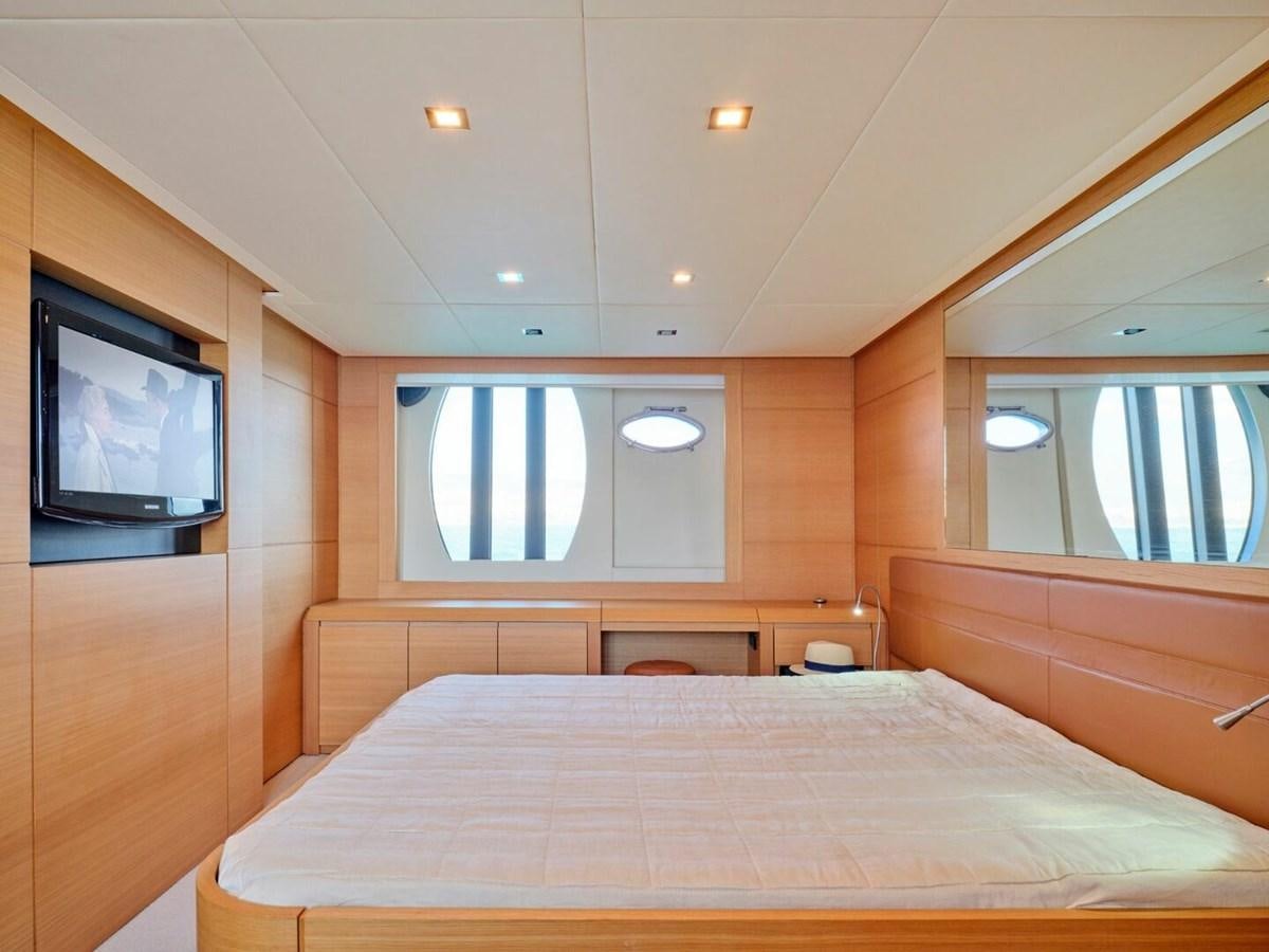 a bed in a room aboard SPLENDID V Yacht for Sale