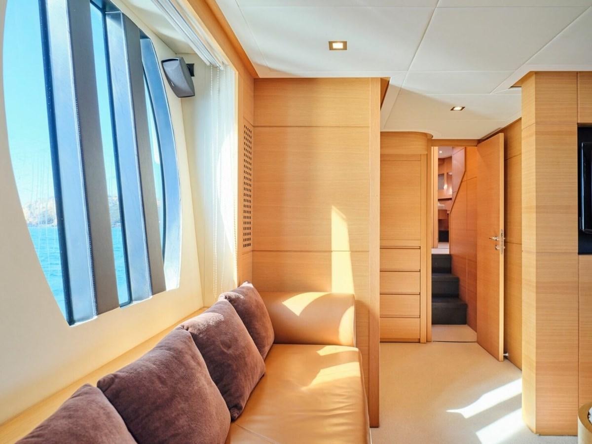 a room with a couch and a window aboard SPLENDID V Yacht for Sale