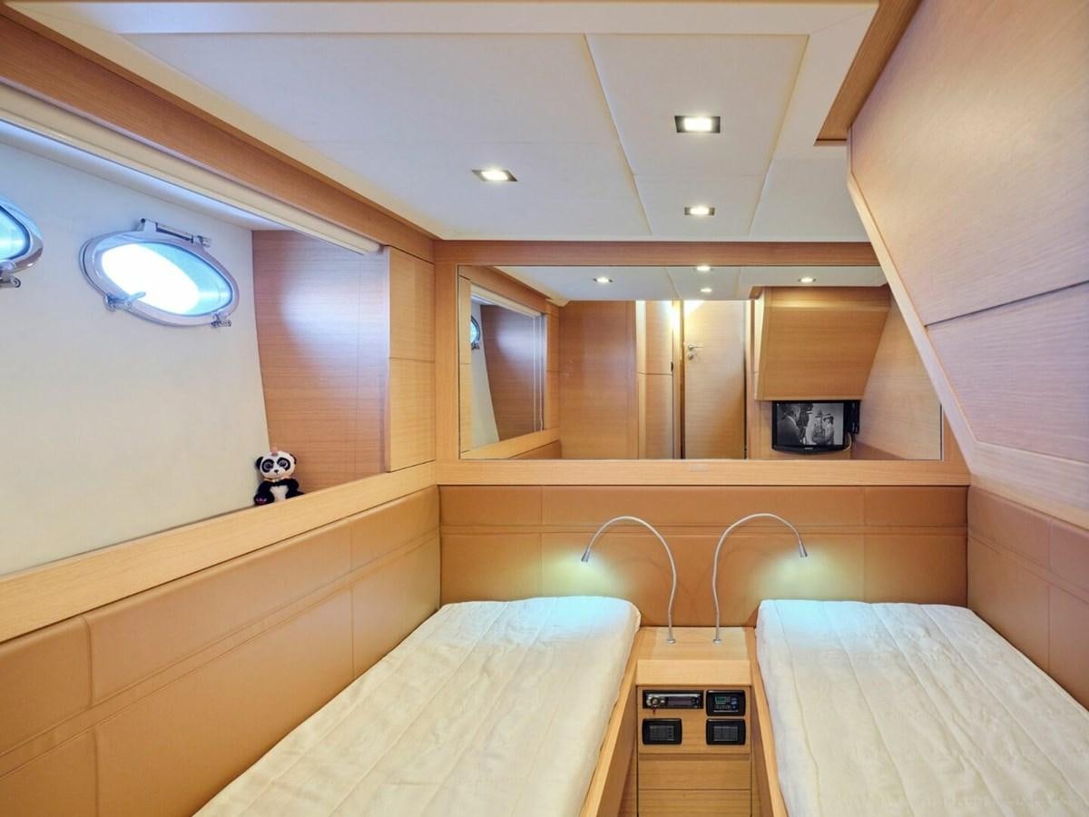 a room with a bed and a mirror aboard SPLENDID V Yacht for Sale