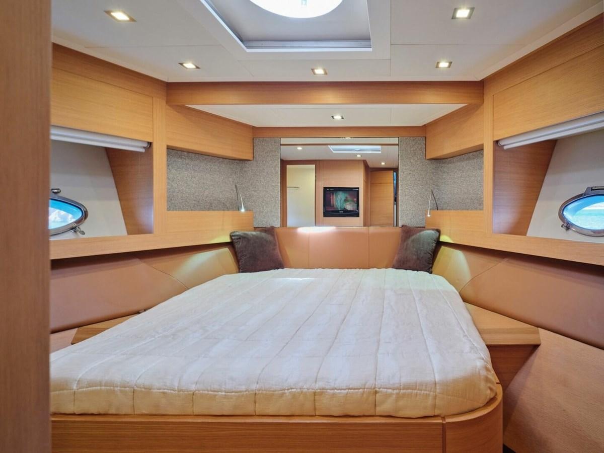 a bed in a room aboard SPLENDID V Yacht for Sale