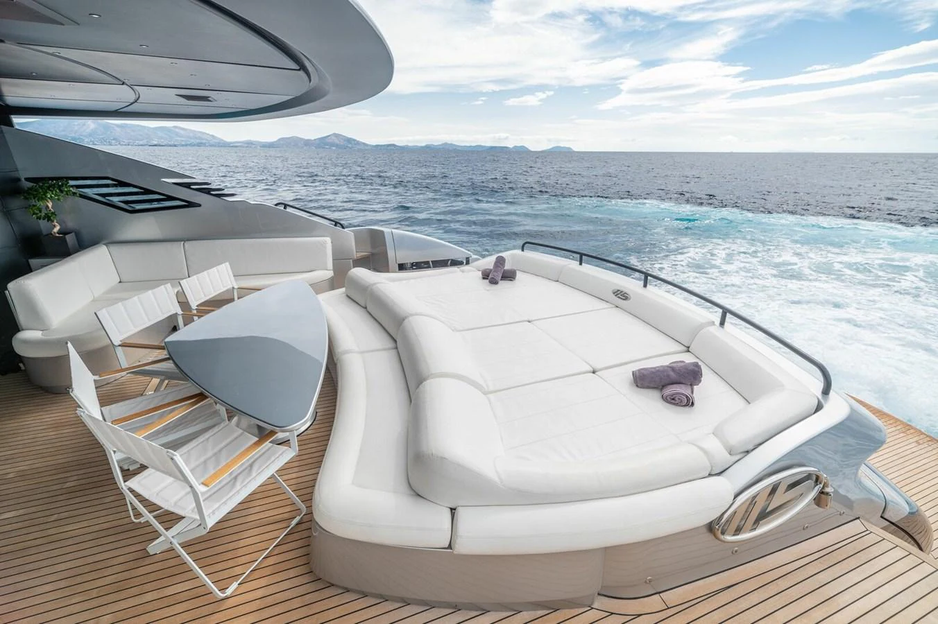 a boat on a deck aboard REBOOT Yacht for Sale