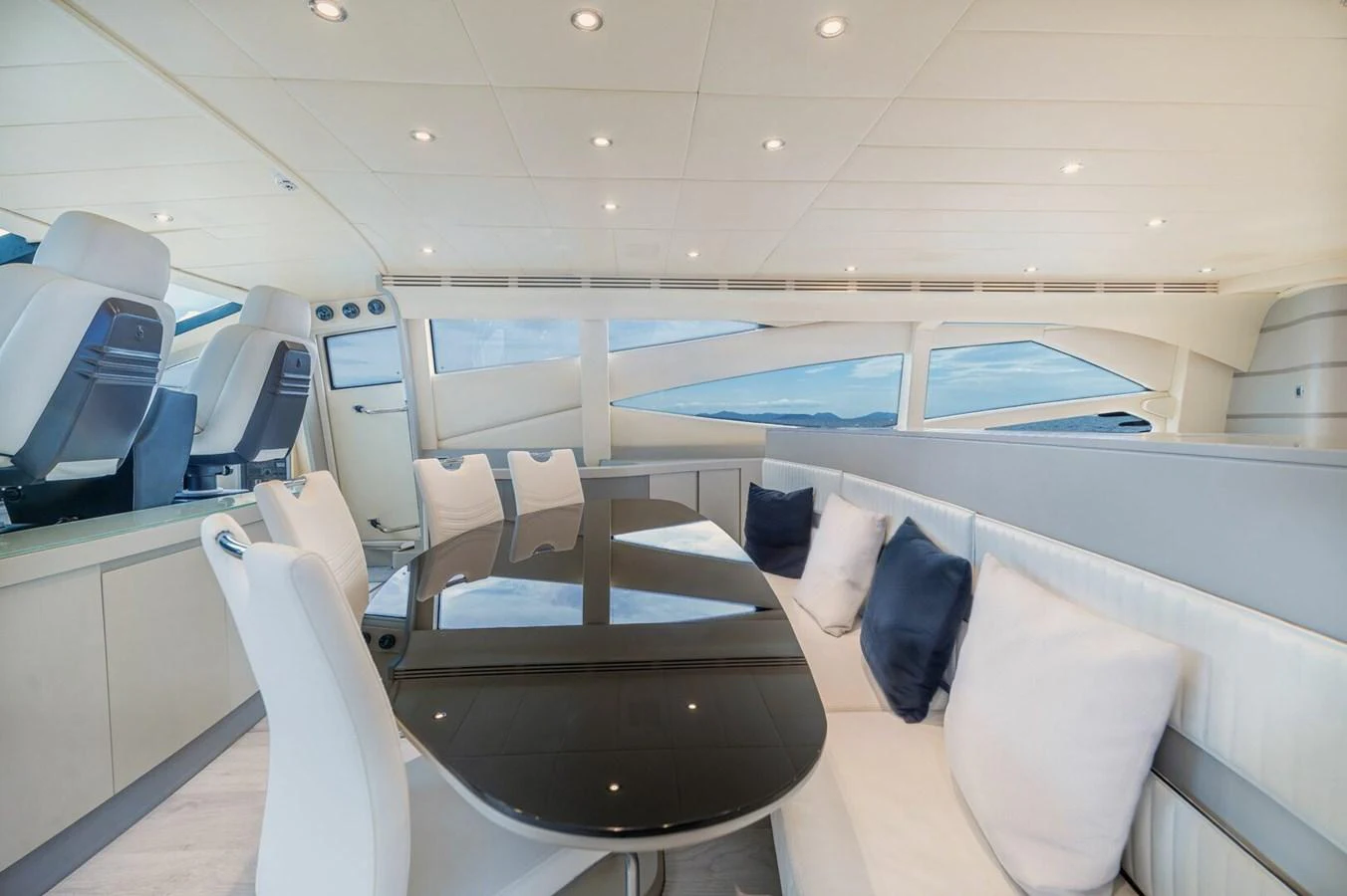 a room with chairs and tables aboard REBOOT Yacht for Sale