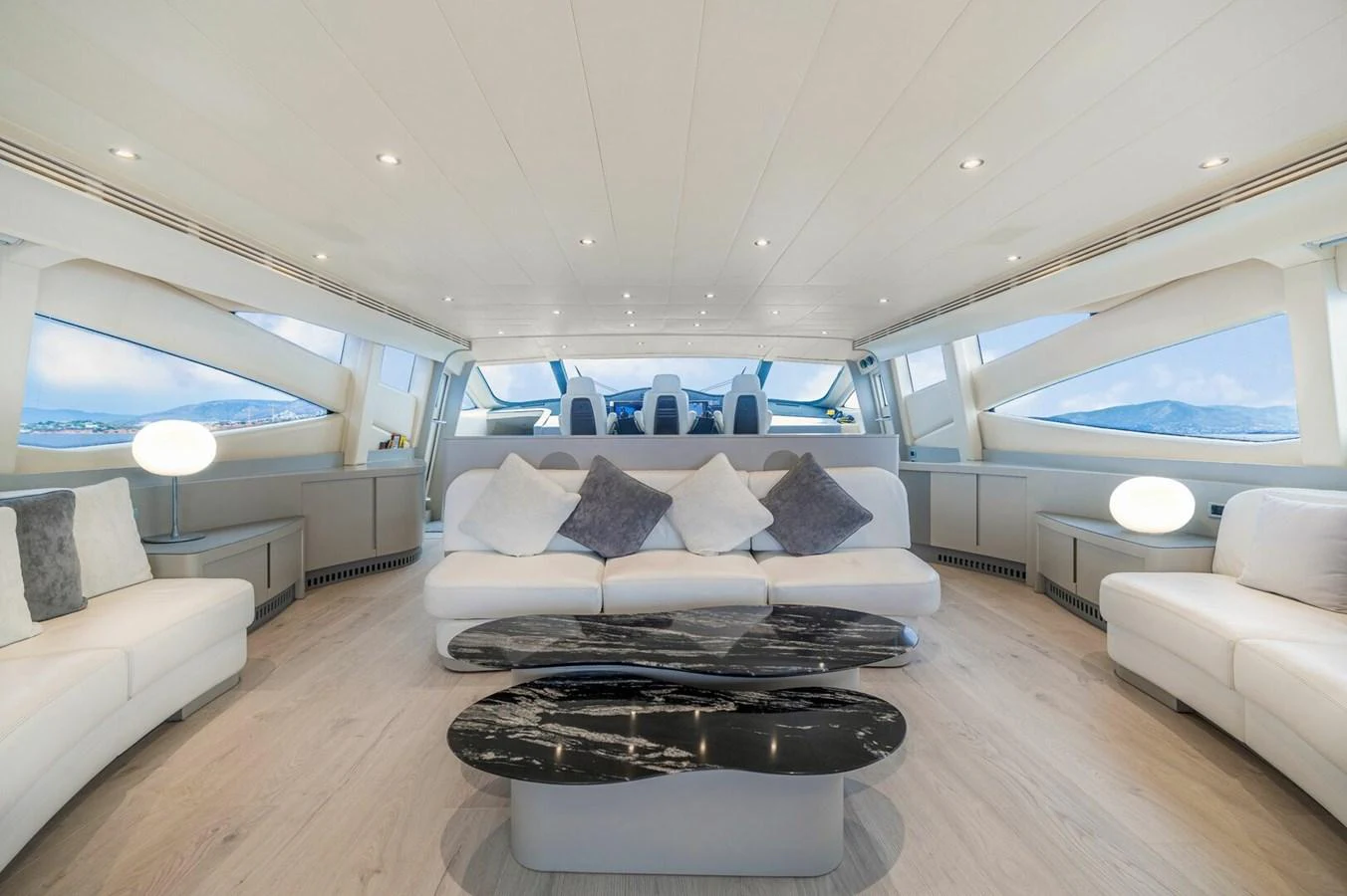 a large white room with a large bed and a large window aboard REBOOT Yacht for Sale