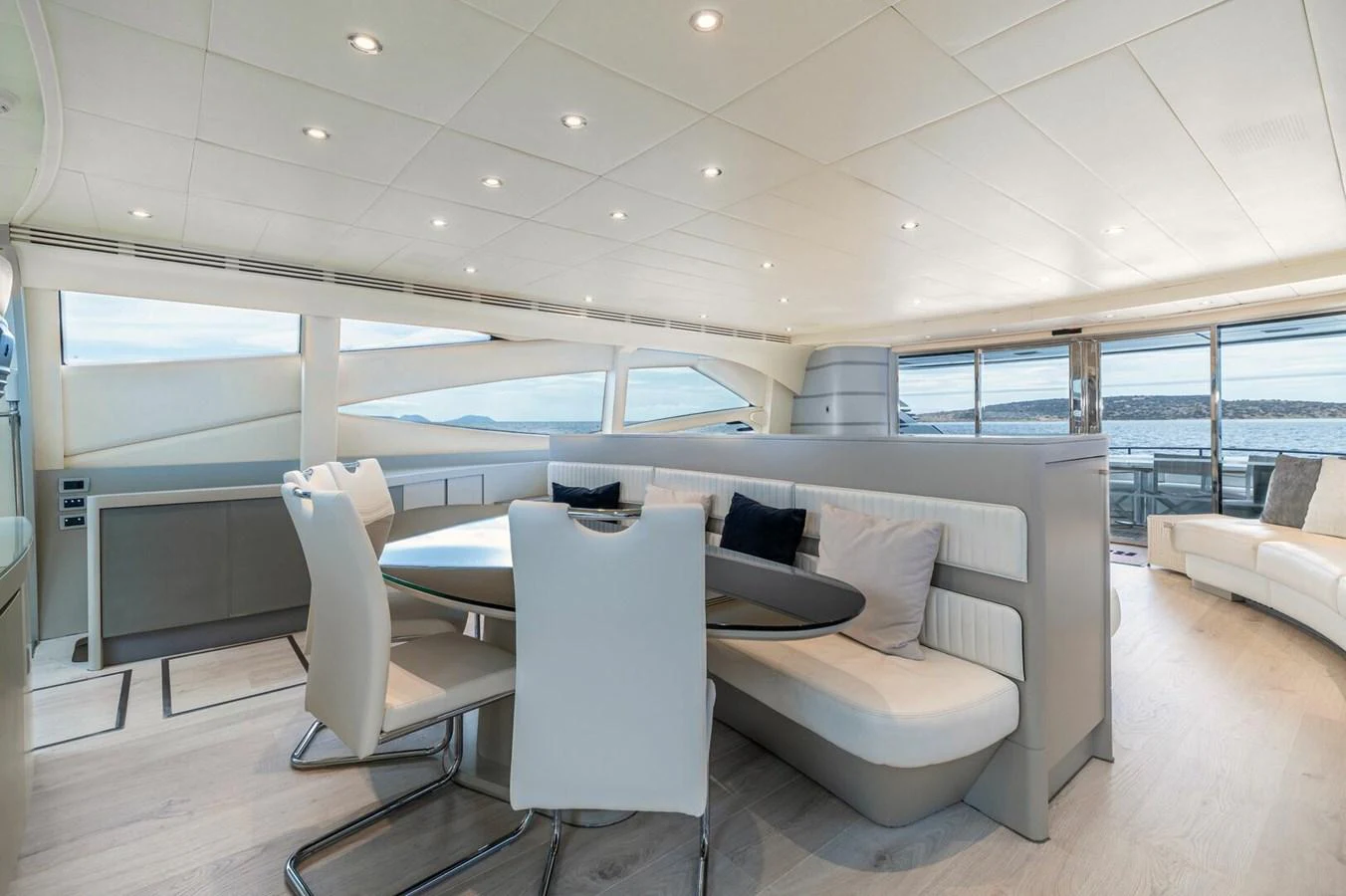 a living room with a couch and a table aboard REBOOT Yacht for Sale