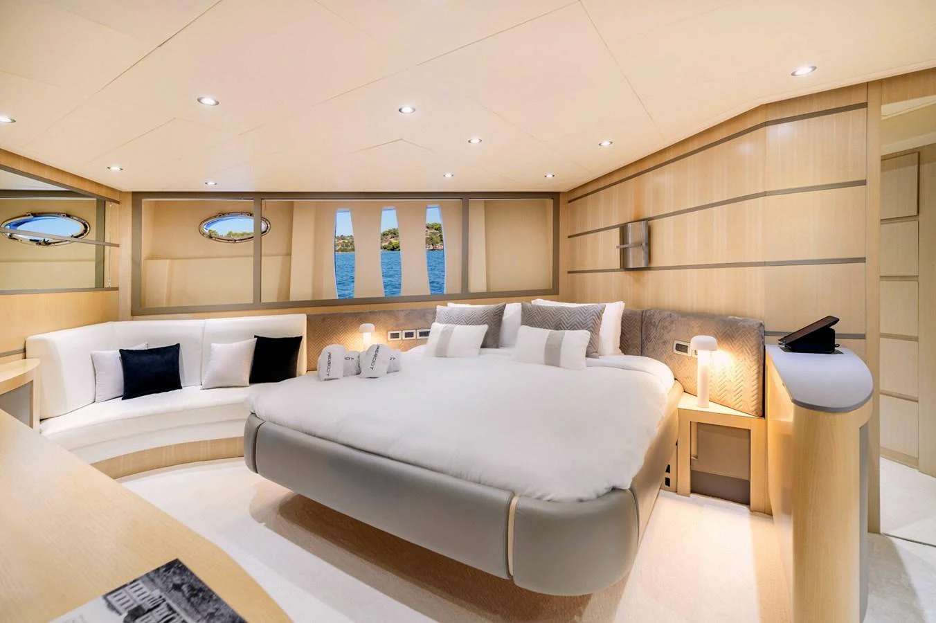 a room with a bed and a table aboard REBOOT Yacht for Sale