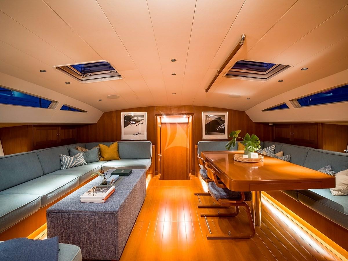 a living room with a couch and a table aboard ONYX II Yacht for Sale