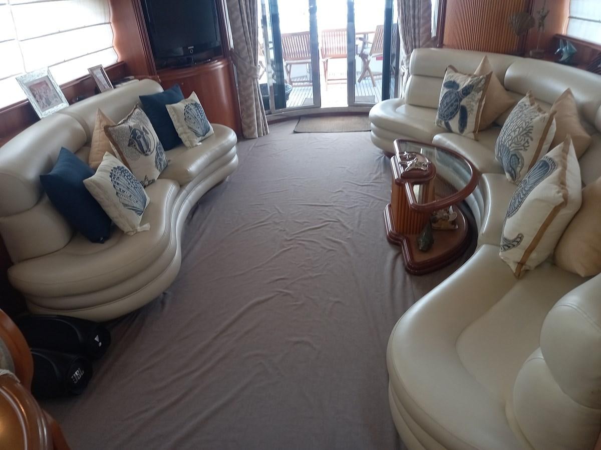 a living room with a large window aboard TANGO - 2003 AZIMUT 85 ULTIMATE @ ACAPULCO Yacht for Sale