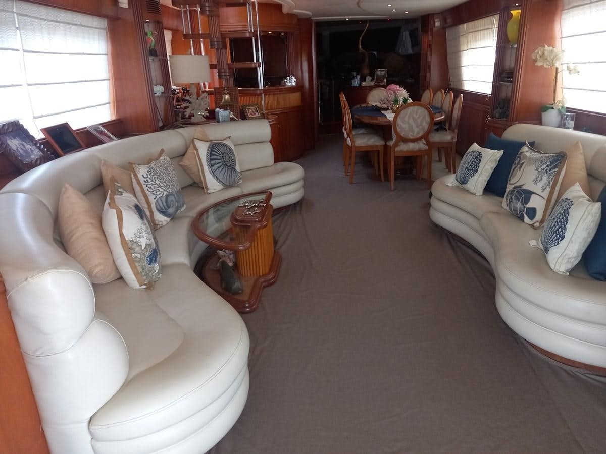 a living room with couches and chairs aboard TANGO - 2003 AZIMUT 85 ULTIMATE @ ACAPULCO Yacht for Sale