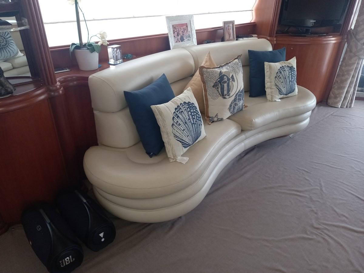 a couch with pillows aboard TANGO - 2003 AZIMUT 85 ULTIMATE @ ACAPULCO Yacht for Sale