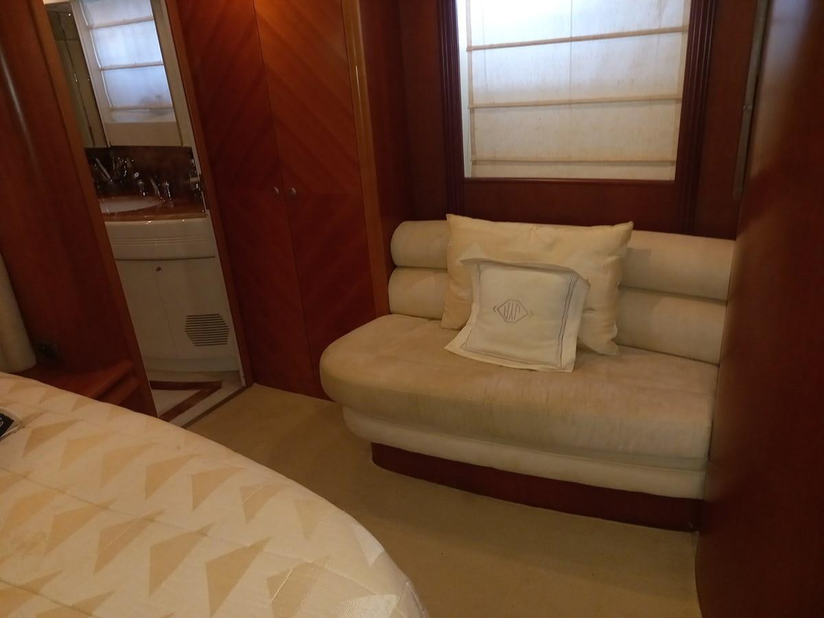 a couch in a room aboard TANGO - 2003 AZIMUT 85 ULTIMATE @ ACAPULCO Yacht for Sale