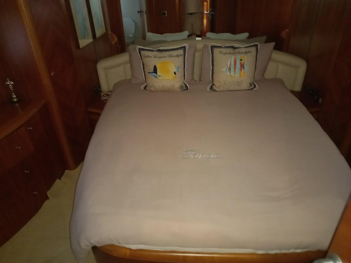 a table with a pillow on it aboard TANGO - 2003 AZIMUT 85 ULTIMATE @ ACAPULCO Yacht for Sale