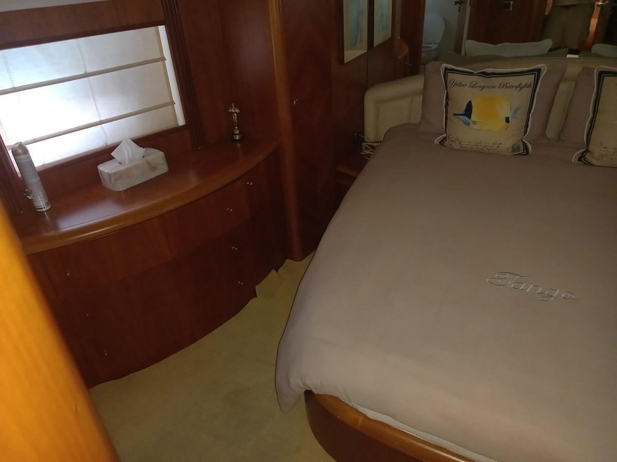 a bed with a white sheet aboard TANGO - 2003 AZIMUT 85 ULTIMATE @ ACAPULCO Yacht for Sale