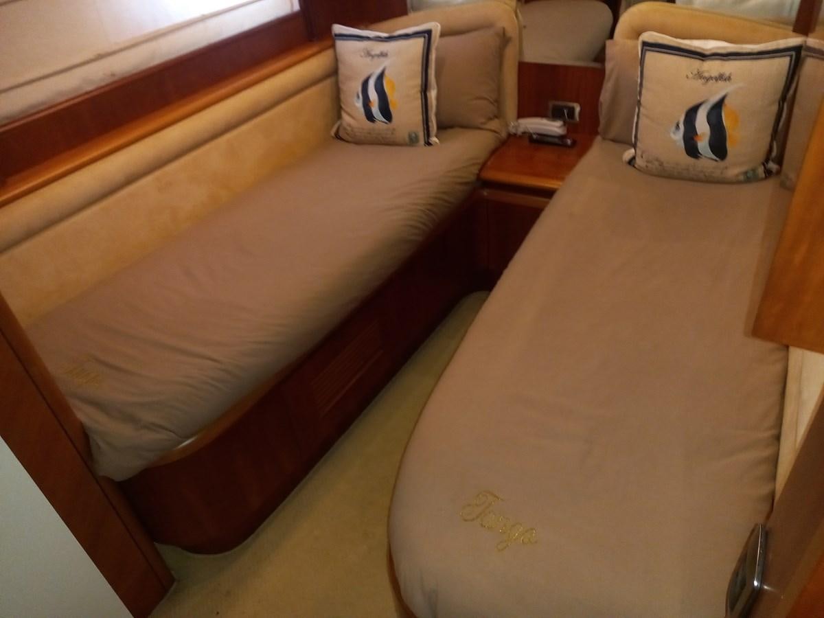 a bed with a pillow and a pillow on it aboard TANGO - 2003 AZIMUT 85 ULTIMATE @ ACAPULCO Yacht for Sale