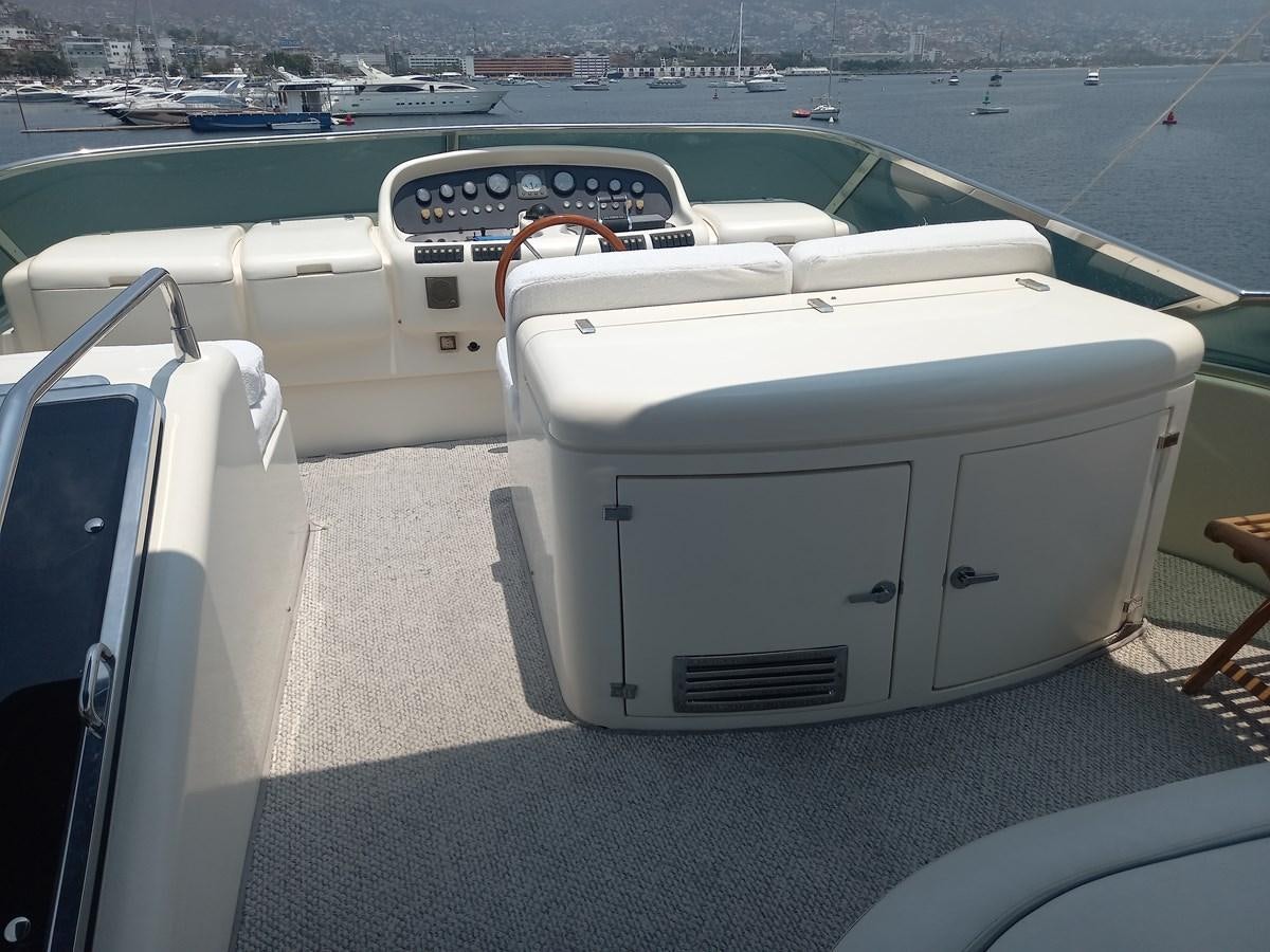 a white car with a dashboard aboard TANGO - 2003 AZIMUT 85 ULTIMATE @ ACAPULCO Yacht for Sale