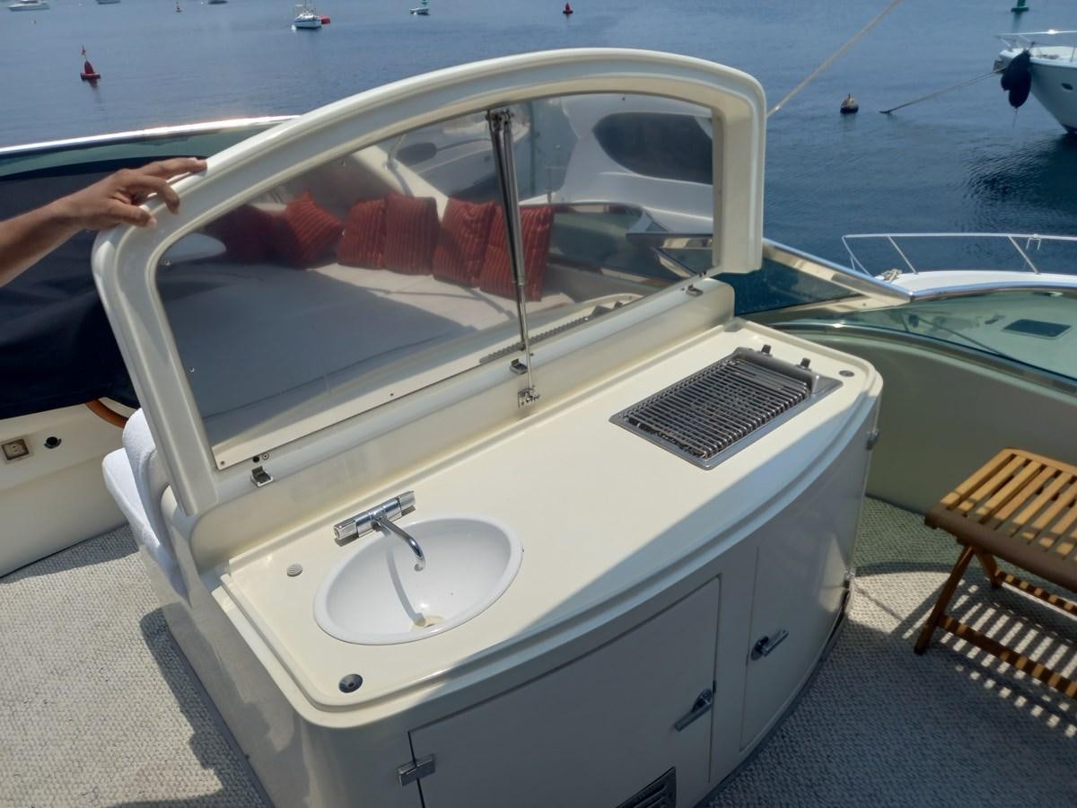 a white boat with a steering wheel aboard TANGO - 2003 AZIMUT 85 ULTIMATE @ ACAPULCO Yacht for Sale