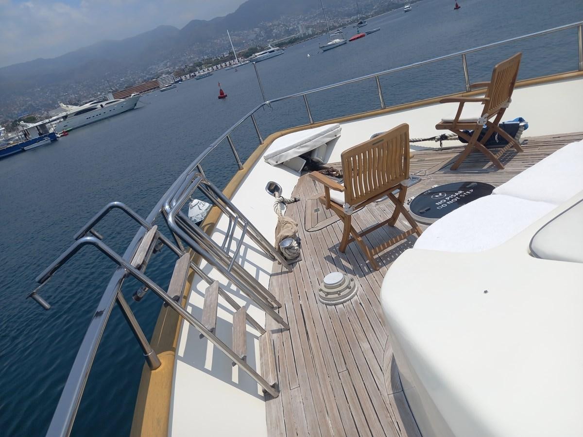 a deck with chairs on it aboard TANGO - 2003 AZIMUT 85 ULTIMATE @ ACAPULCO Yacht for Sale