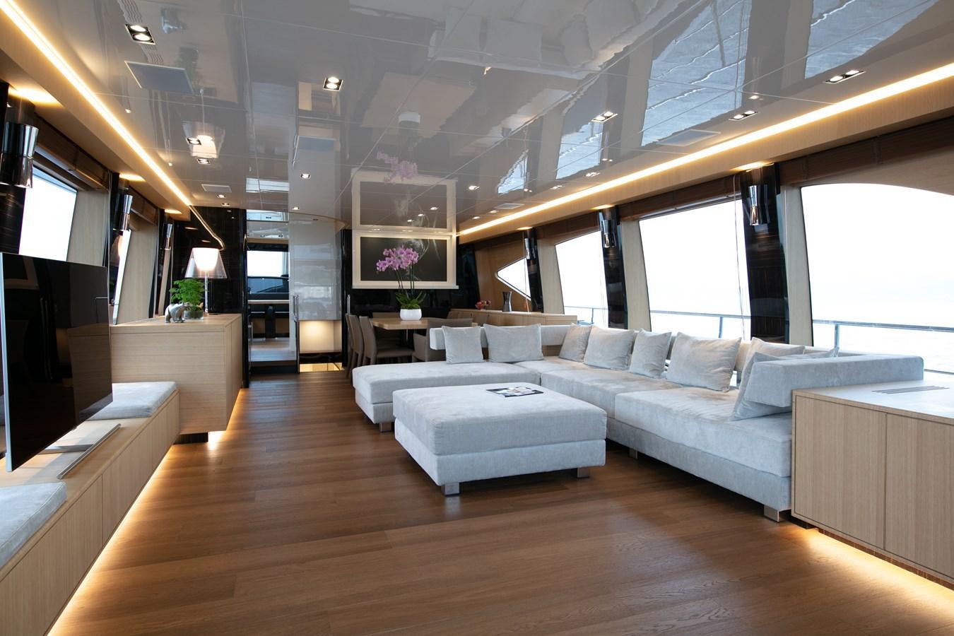 a living room with a large window aboard NEW CANADOS 888 EVO Yacht for Sale