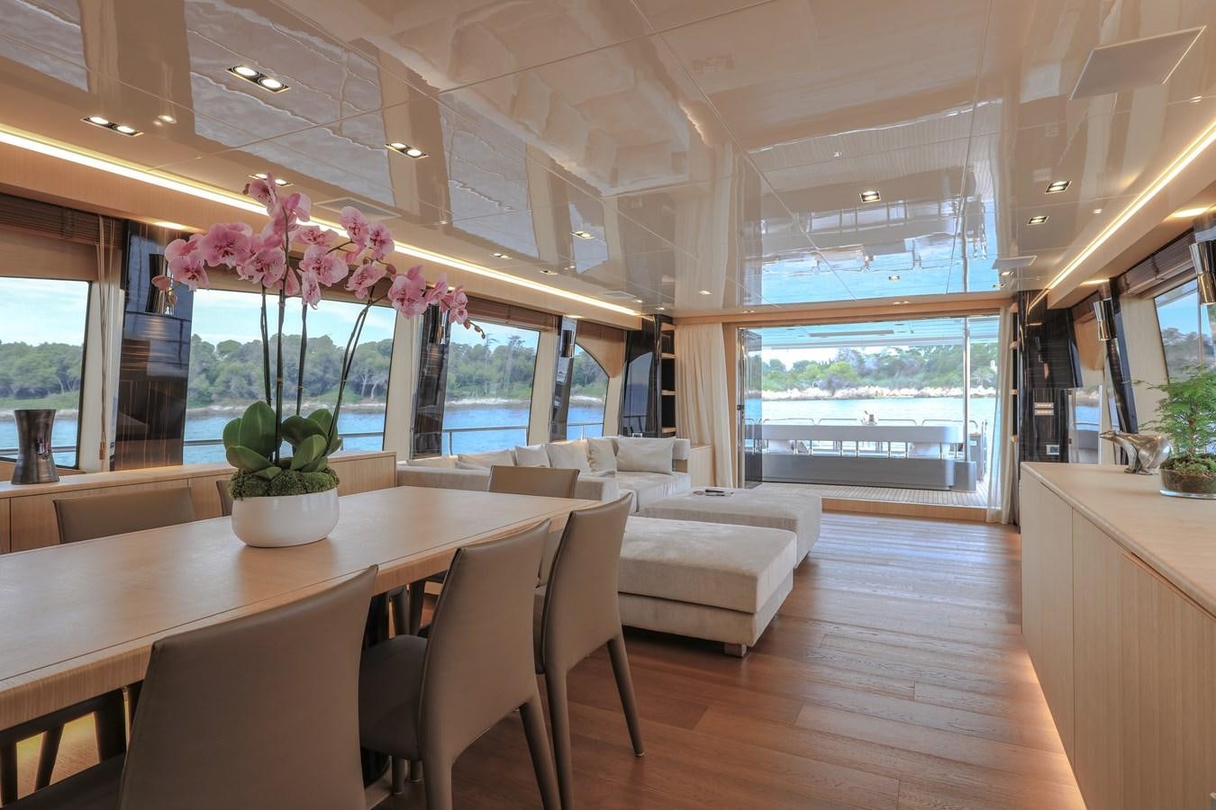 a room with a table and chairs aboard NEW CANADOS 888 EVO Yacht for Sale