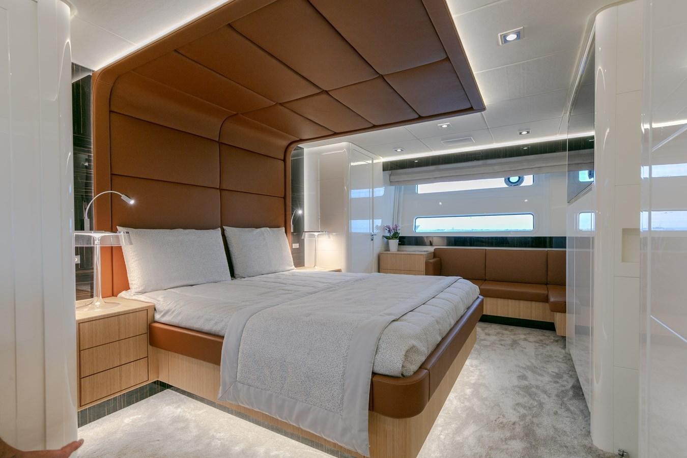 a room with a bed and a desk aboard NEW CANADOS 888 EVO Yacht for Sale