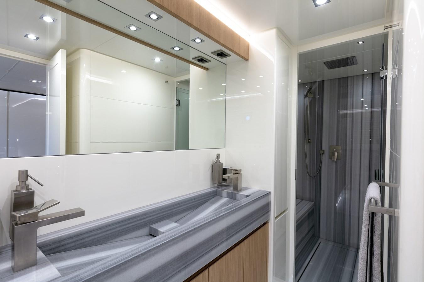 a bathroom with a large mirror aboard NEW CANADOS 888 EVO Yacht for Sale