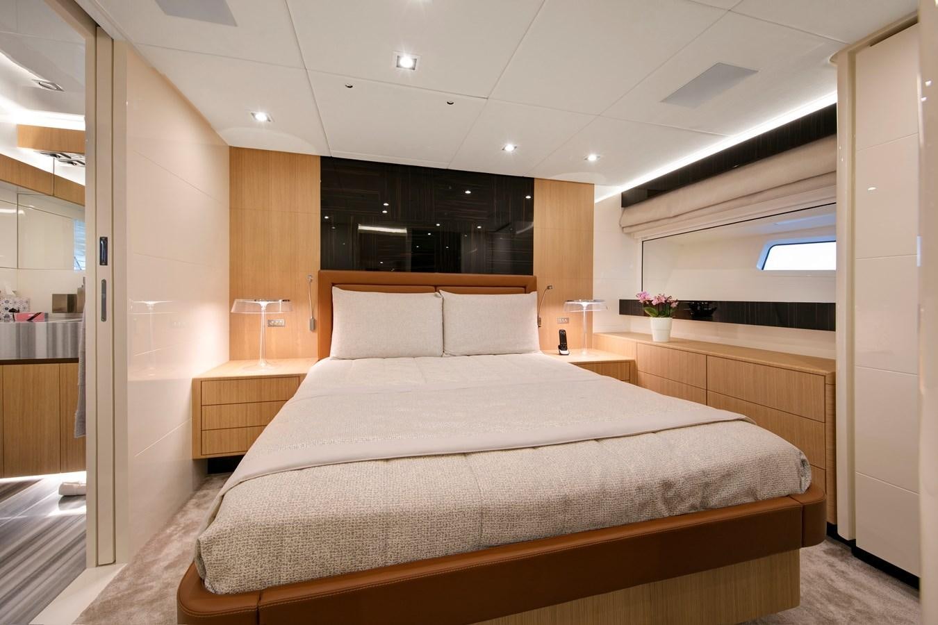 a large bed in a room aboard NEW CANADOS 888 EVO Yacht for Sale
