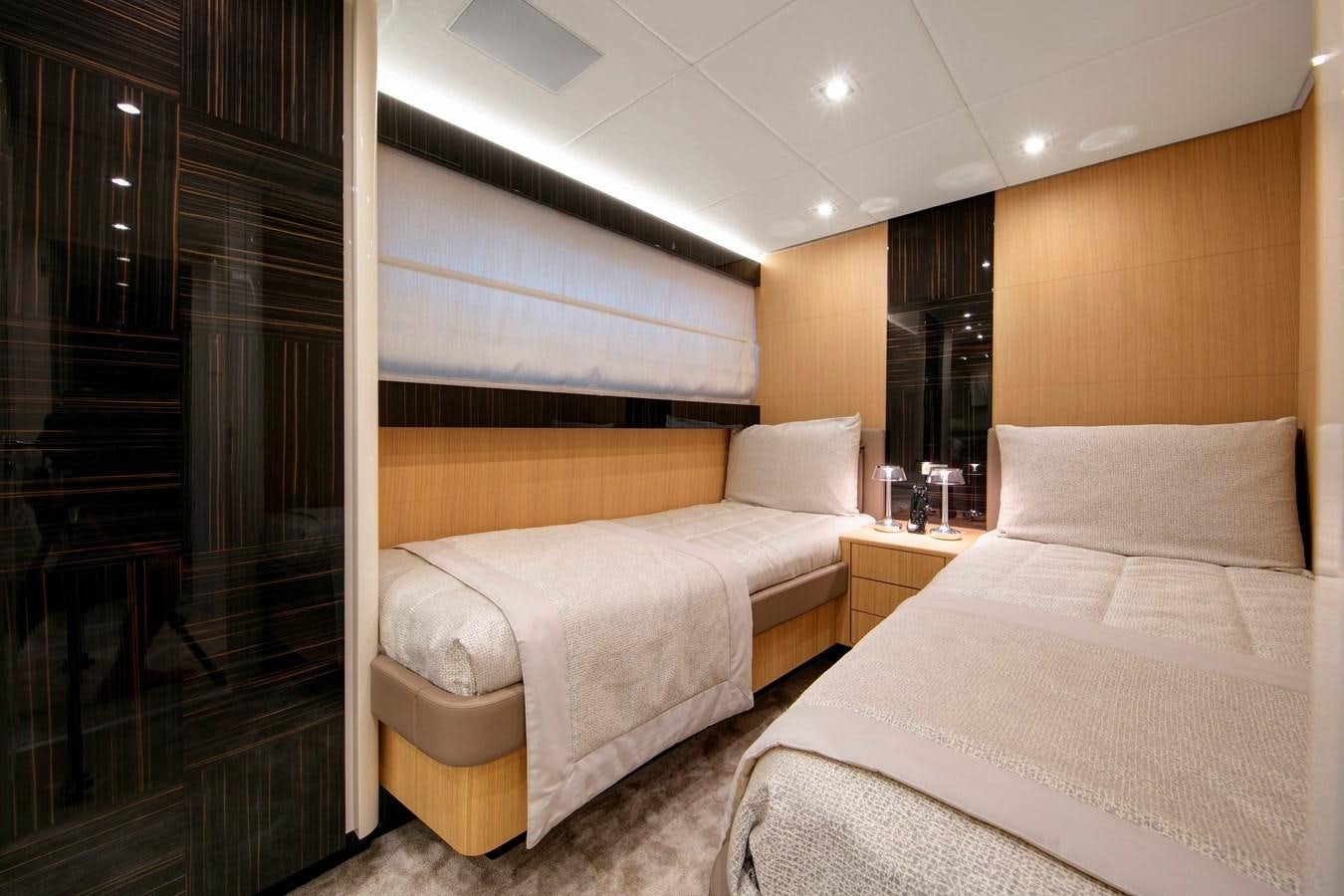 a room with two beds aboard NEW CANADOS 888 EVO Yacht for Sale