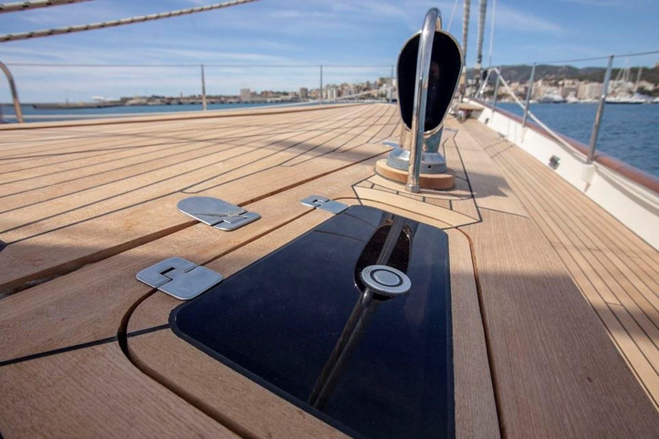 a black device on a wooden deck aboard SWEET EMOTION Yacht for Sale