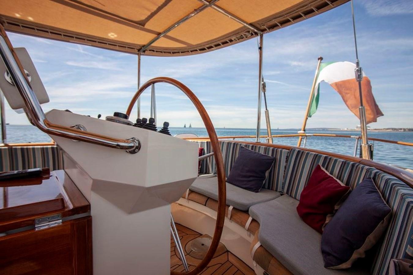 a boat with a person on the deck aboard SWEET EMOTION Yacht for Sale