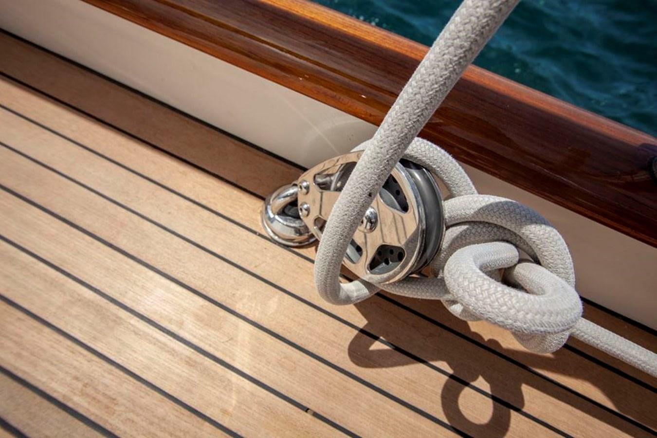 a metal ring on a wooden surface aboard SWEET EMOTION Yacht for Sale