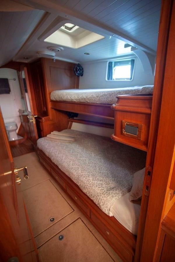 a bedroom with a bed aboard SWEET EMOTION Yacht for Sale