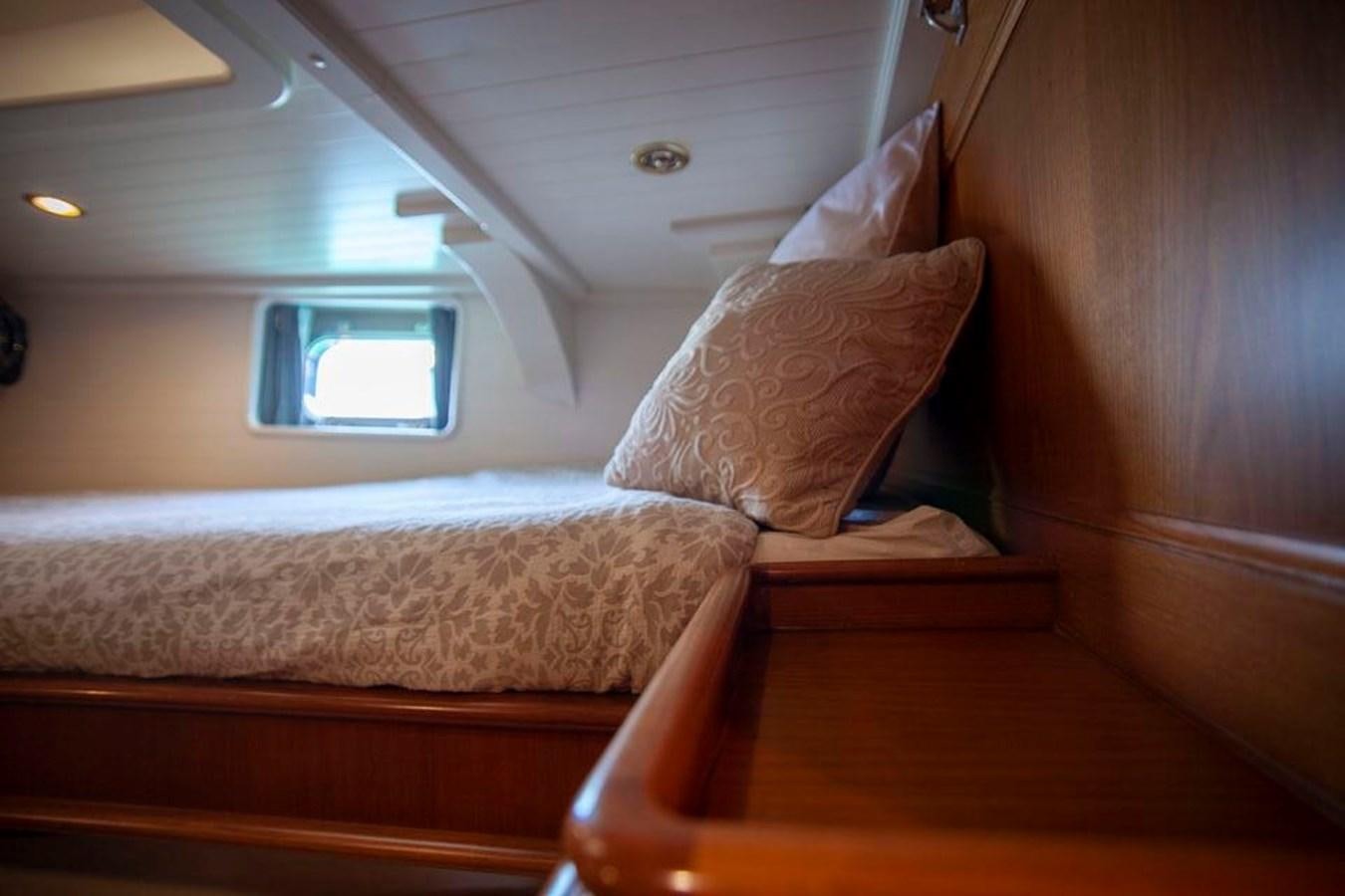 a bed with pillows aboard SWEET EMOTION Yacht for Sale