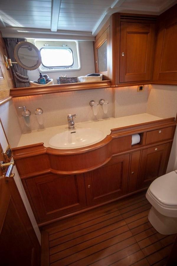 a bathroom with a sink and a mirror aboard SWEET EMOTION Yacht for Sale