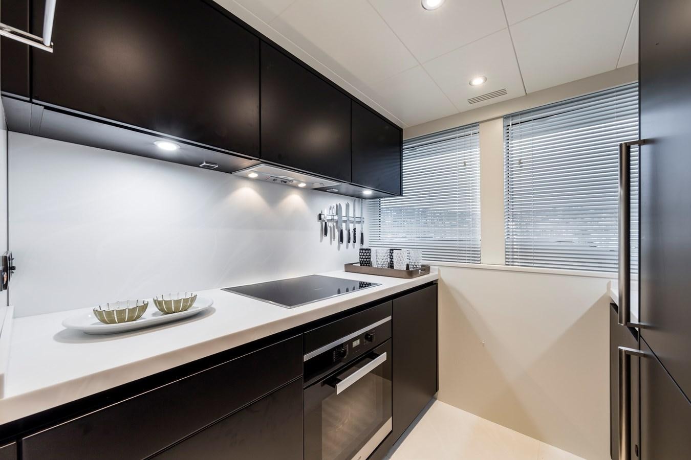 a kitchen with a sink and cabinets aboard NEW OCEANIC 76/81 GT Yacht for Sale